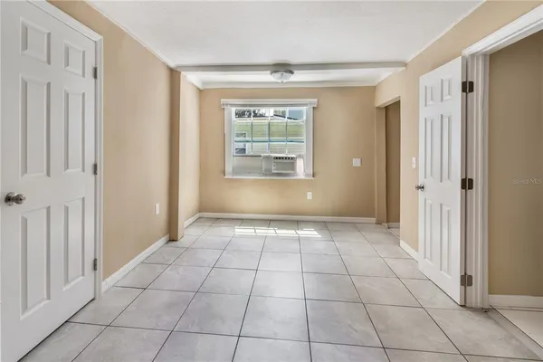 a view of an empty room and window