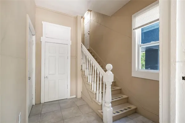 a view of a hallway with staircase