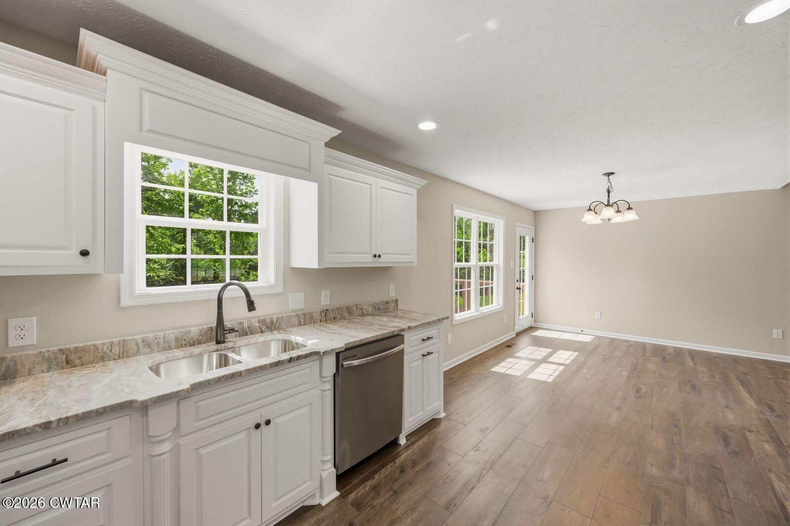 435 Old Huntingdon Road Lexington, TN 38351 - Photo 2 of 26 a kitchen with a sink cabinets and window