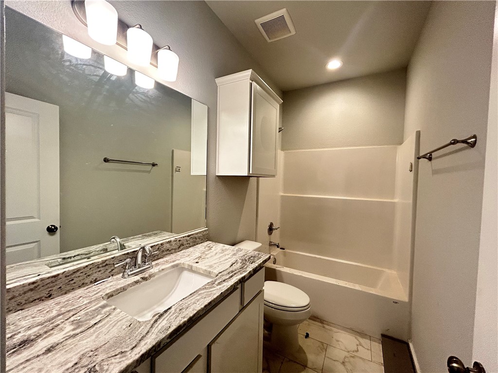 2791 Messenger Way Bryan, TX 77803 - Photo 8 of 15 a bathroom with a granite countertop sink toilet and shower
