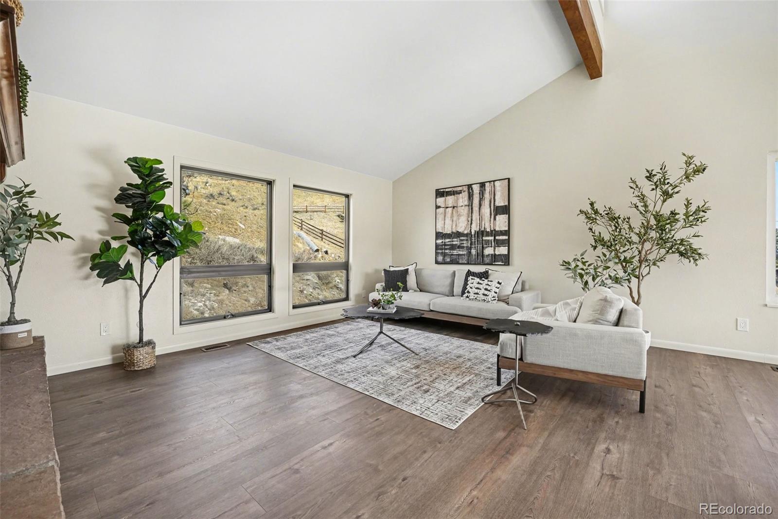 3260 Bit Road Evergreen, CO 80439 - Photo 4 of 26 a living room with furniture and a potted plant