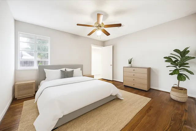 a bedroom with bed and window