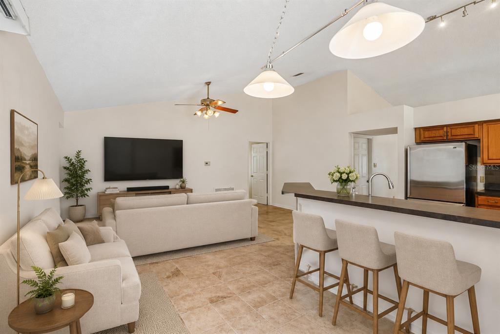 2596 Alclobe Circle Ocoee, FL 34761 - Photo 28 of 70 a living room with furniture and a flat screen tv