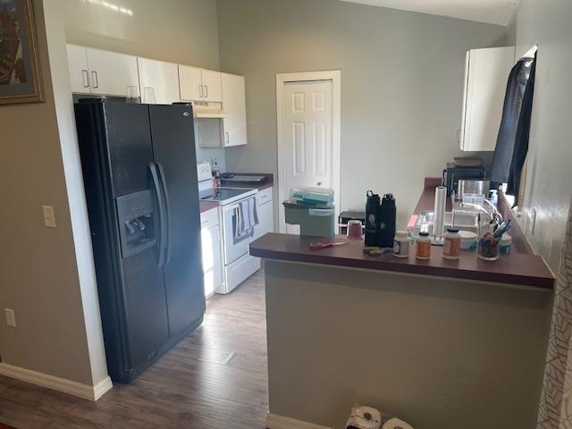 14 Random Place Palm Coast, FL 32164 - Photo 5 of 25 a kitchen with stainless steel appliances a refrigerator and a sink