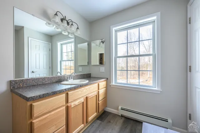 a bathroom with a glass door shower