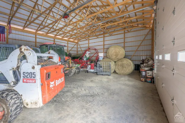 a view of a yard with snow on the road