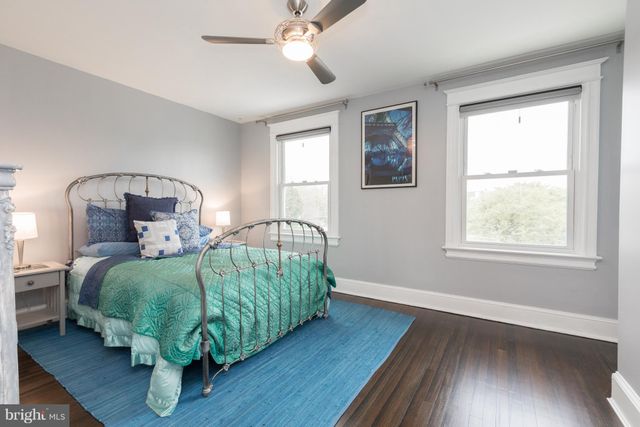 a bedroom with bed and a window