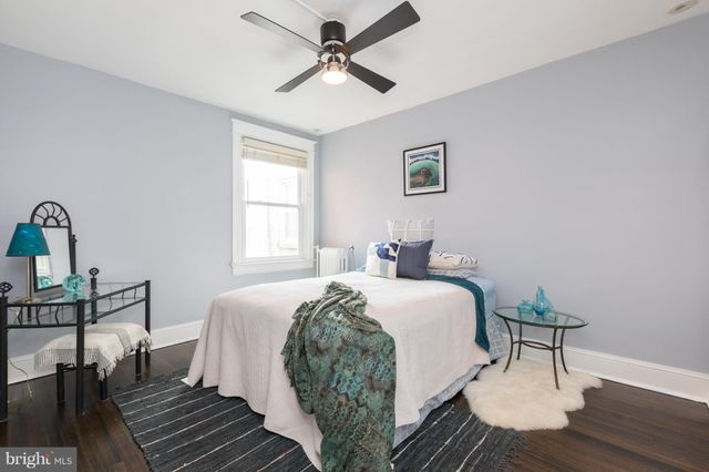 a bed room with a bed and a table