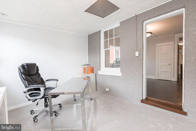 wooden floor and chair in a room