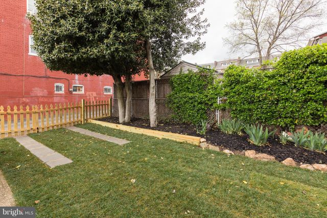 a view of a swimming pool with lounge chairs