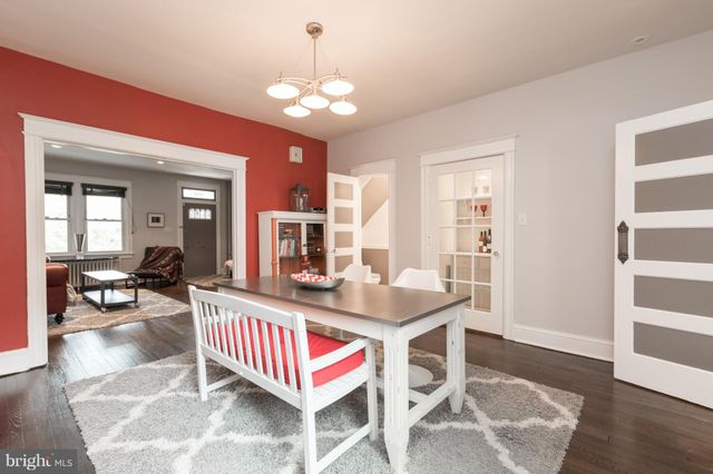 a very nice looking dining room with a table and chairs