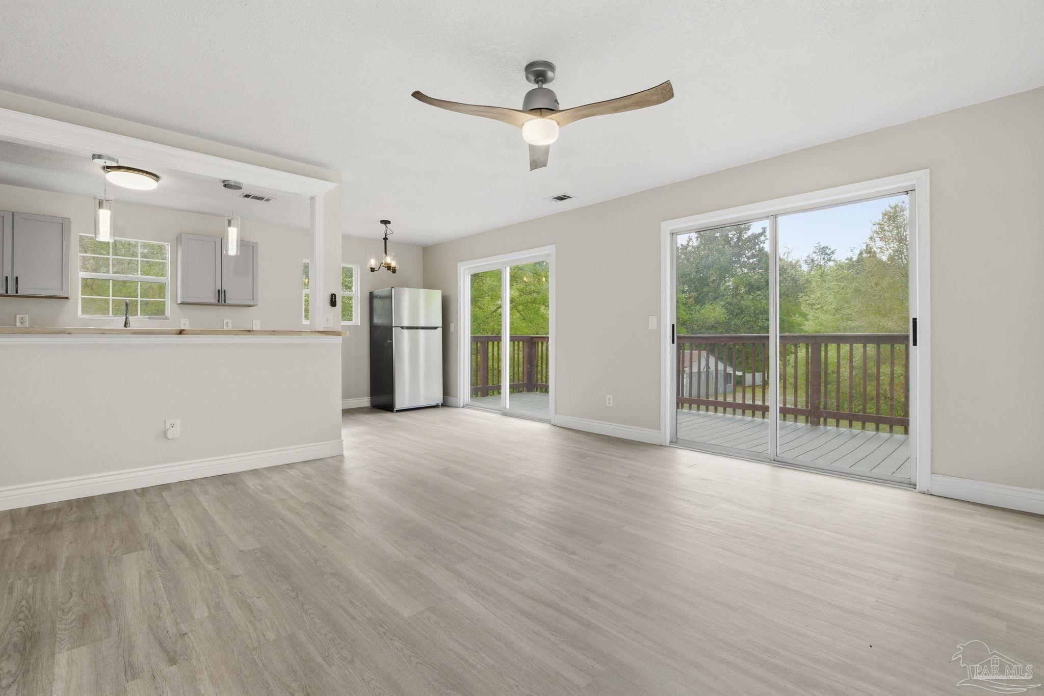 4032 Mae Lane Milton, FL 32583 - Photo 14 of 50 a view of an empty room with a window