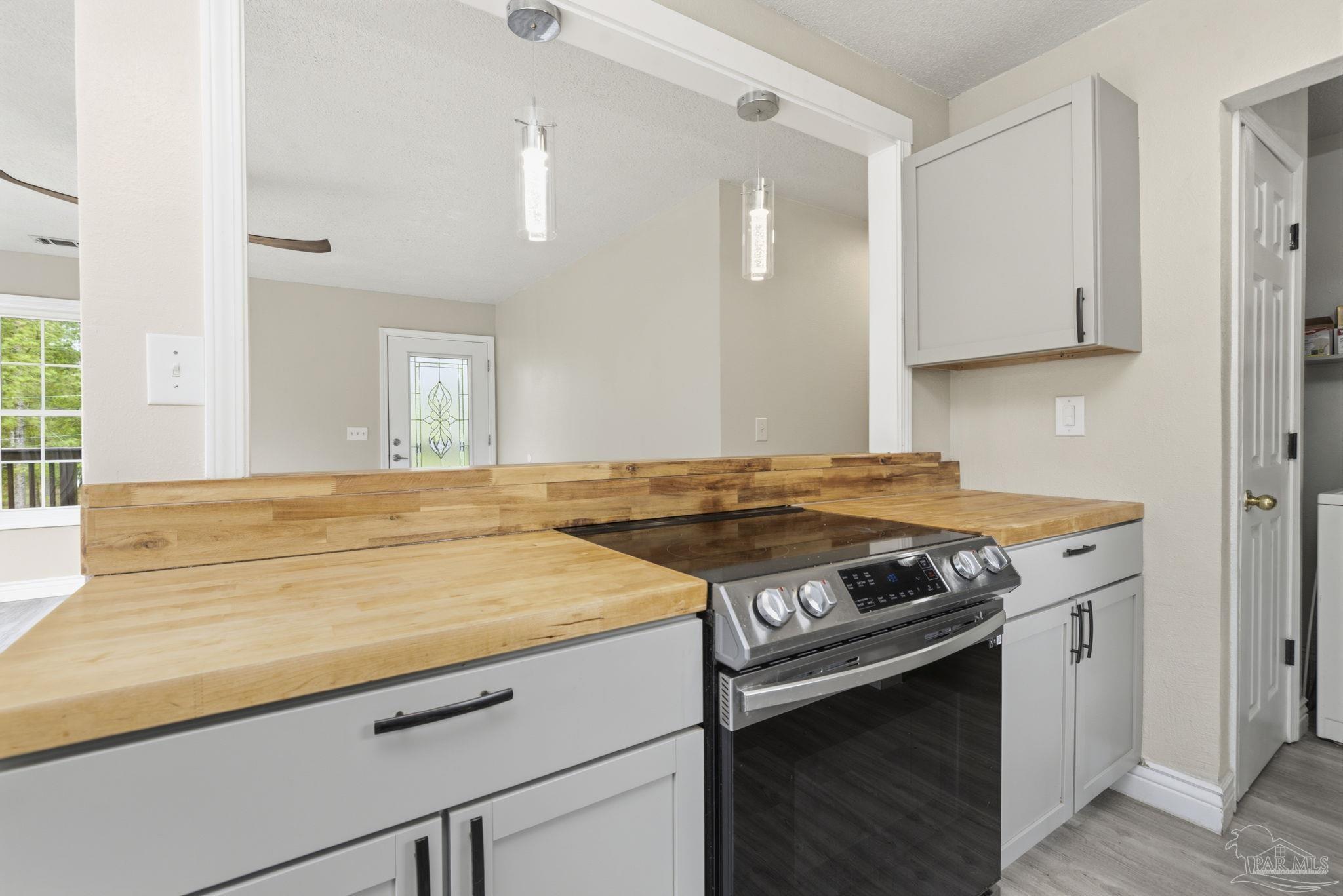 4032 Mae Lane Milton, FL 32583 - Photo 18 of 50 a kitchen with a stove and a sink