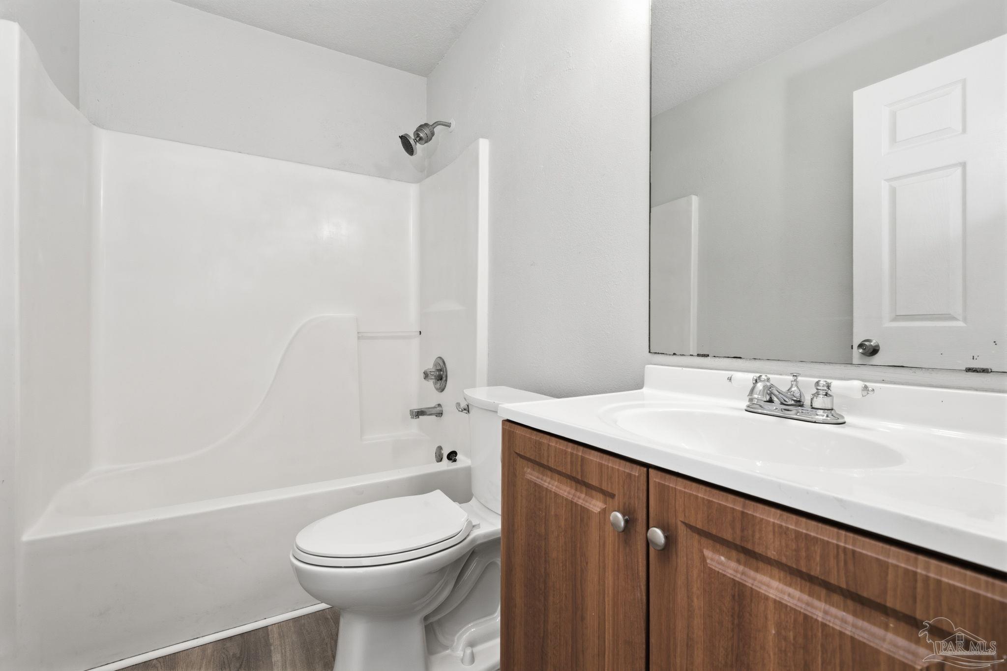 4032 Mae Lane Milton, FL 32583 - Photo 22 of 50 a bathroom with a sink a toilet and shower