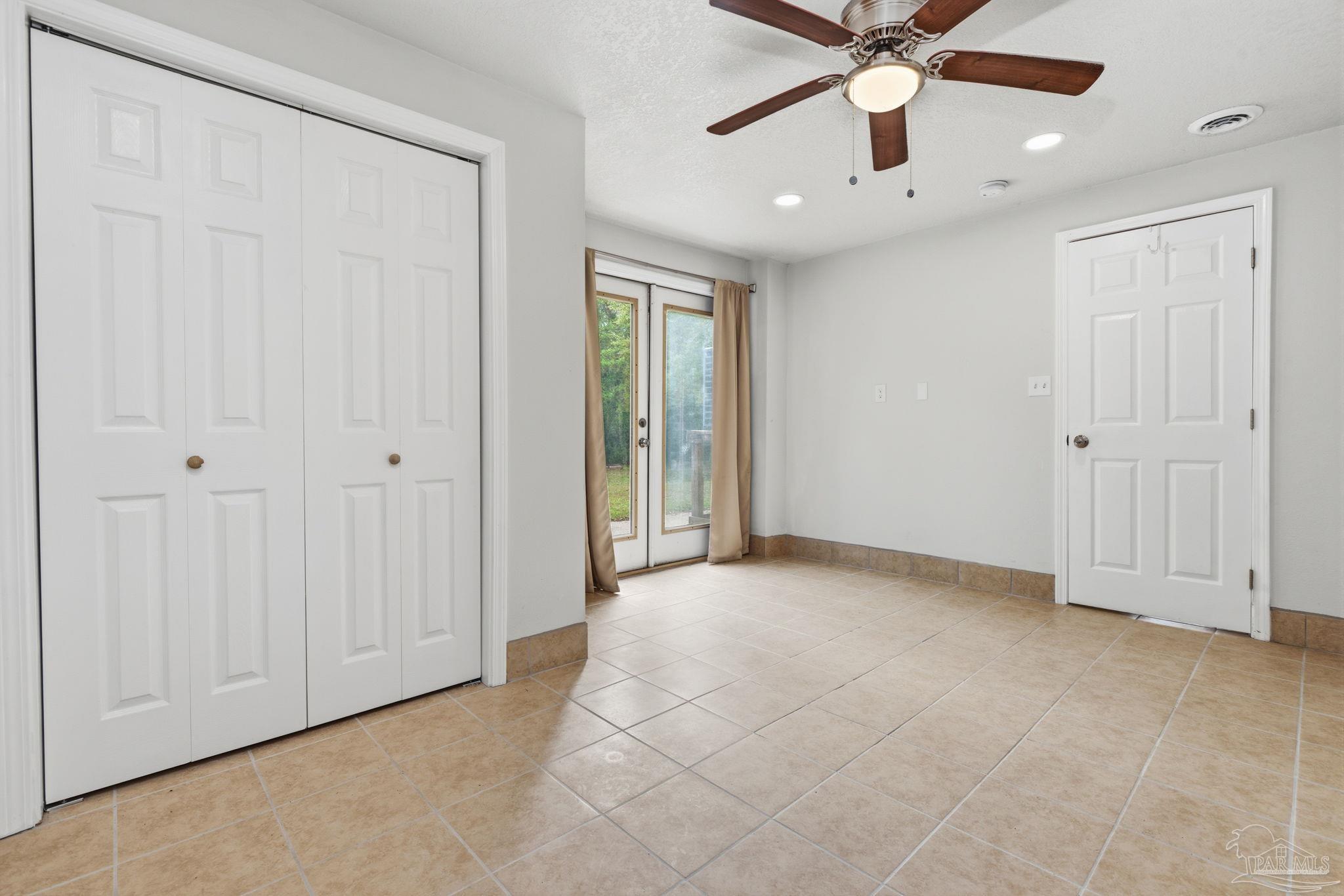 4032 Mae Lane Milton, FL 32583 - Photo 33 of 50 an empty room with fan and windows