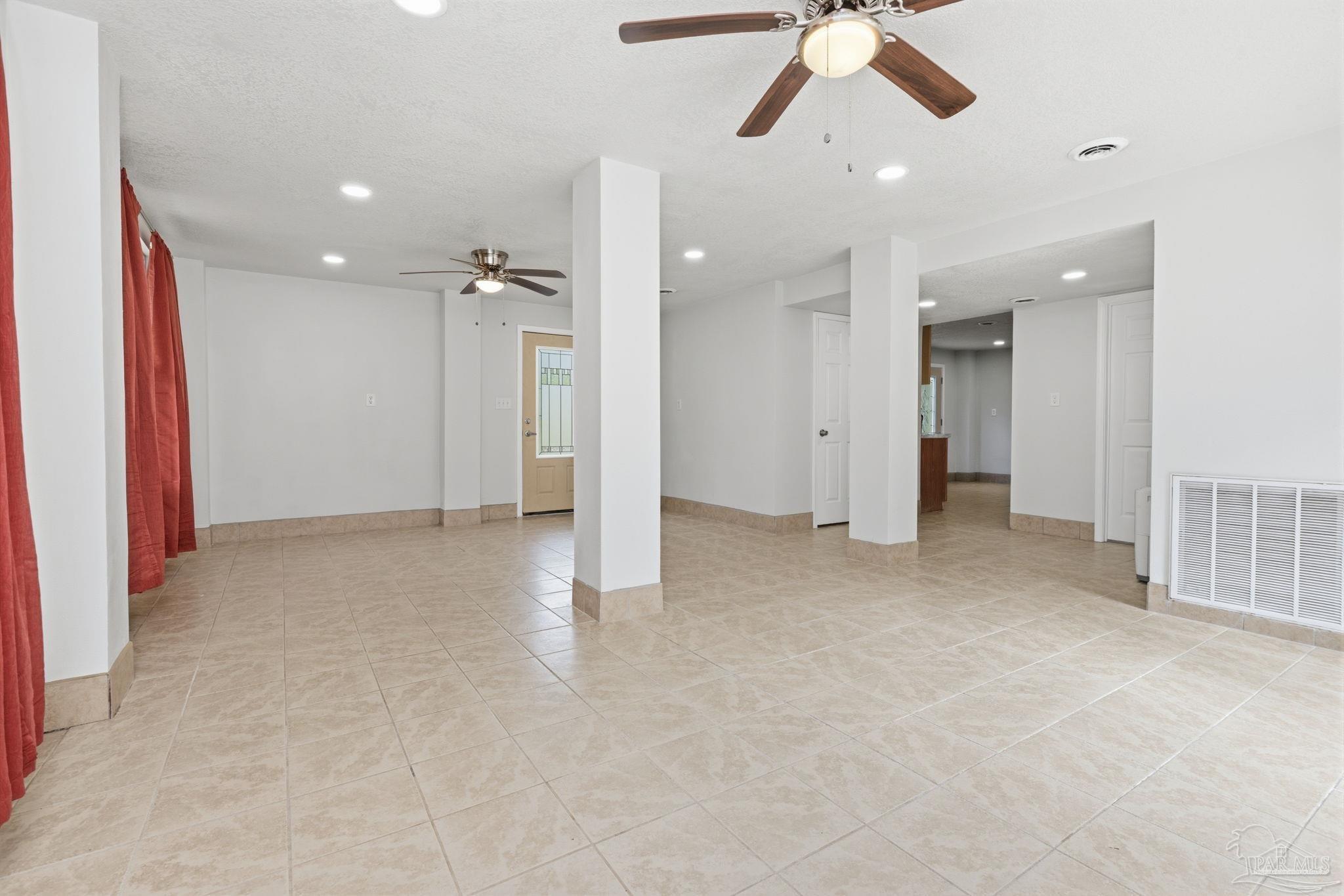 4032 Mae Lane Milton, FL 32583 - Photo 35 of 50 wooden floor in an empty room with a ceiling fan