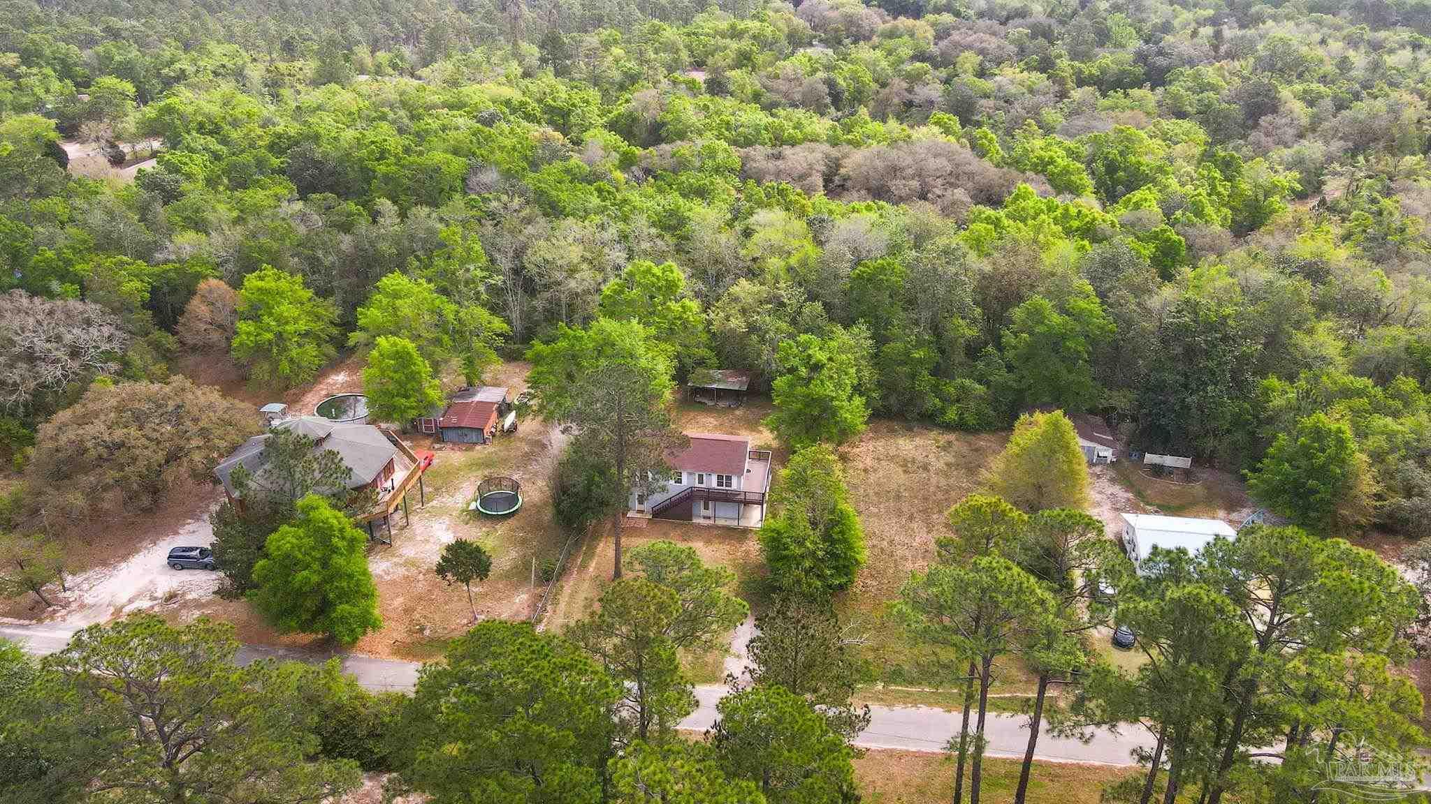 4032 Mae Lane Milton, FL 32583 - Photo 46 of 50 an aerial view of residential house with outdoor space and trees all around