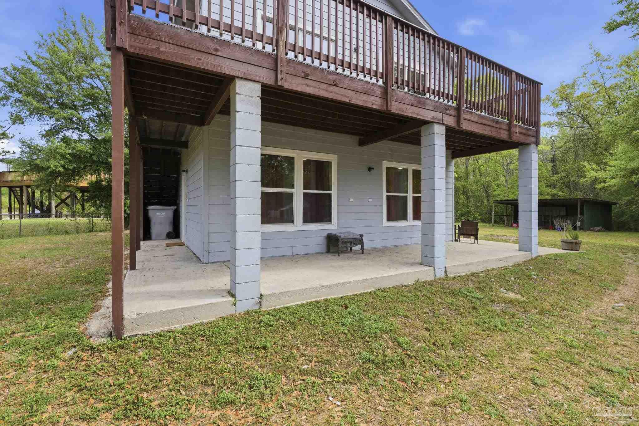 4032 Mae Lane Milton, FL 32583 - Photo 6 of 50 a view of a house with backyard and porch