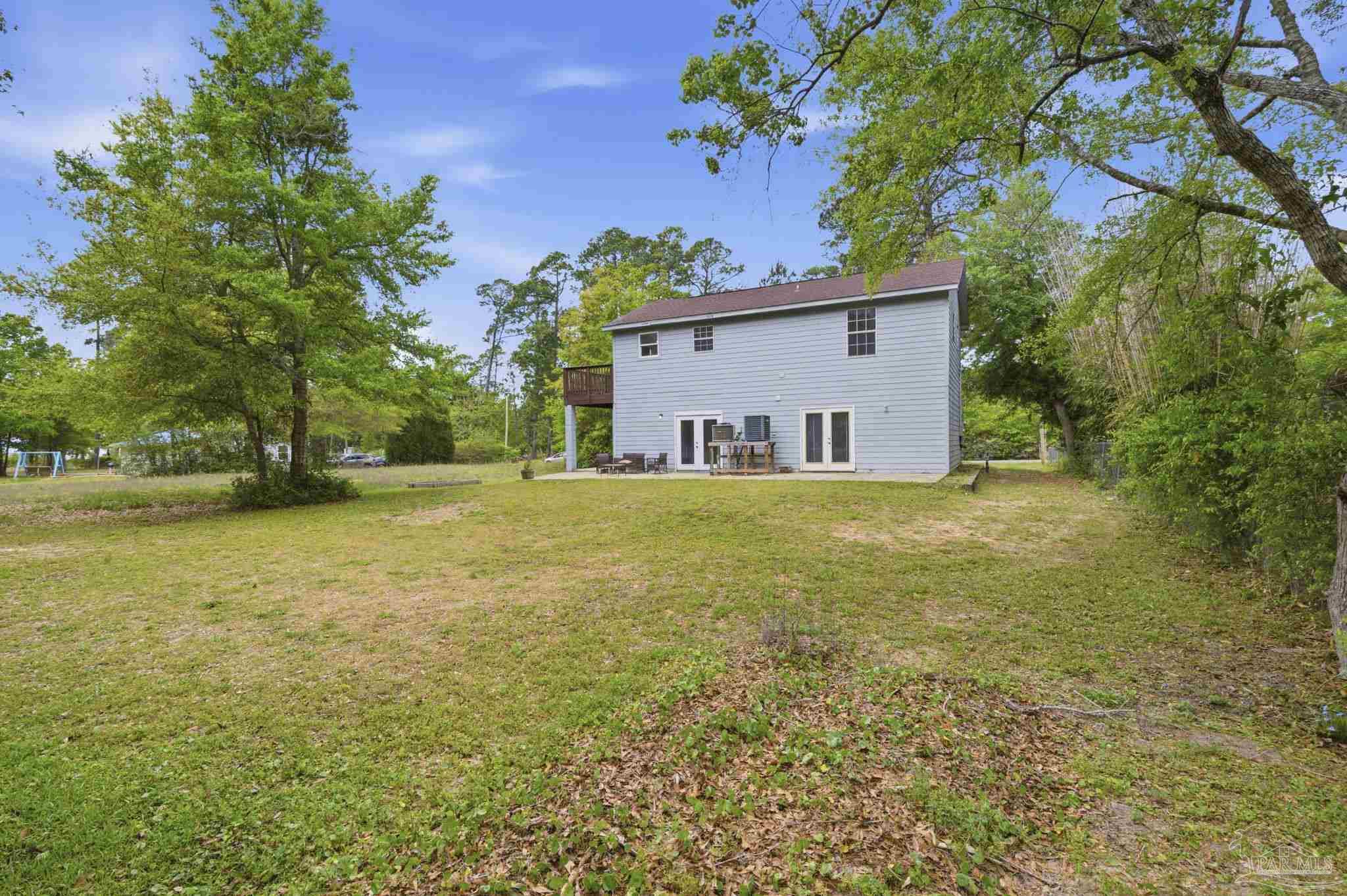 4032 Mae Lane Milton, FL 32583 - Photo 9 of 50 a house view with a outdoor space
