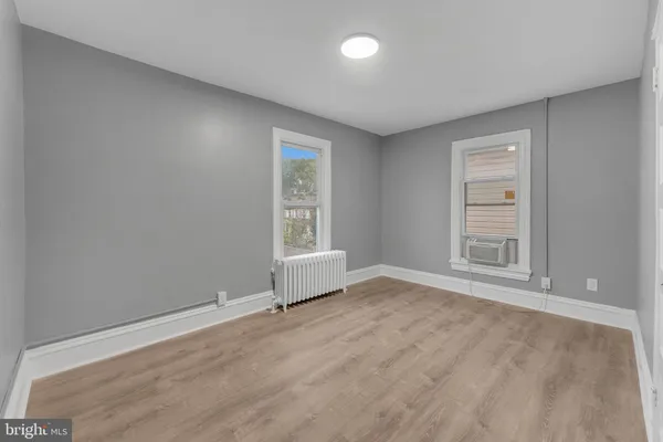 a view of a hallway with a window