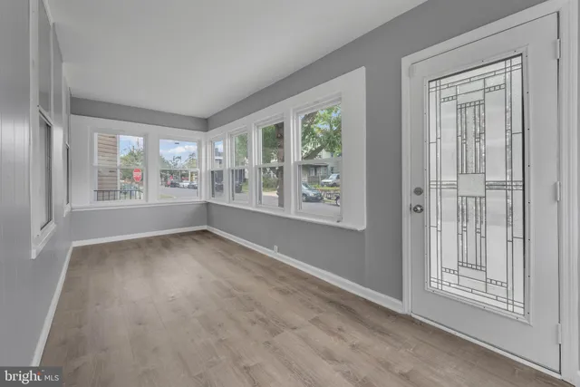 an empty room with windows