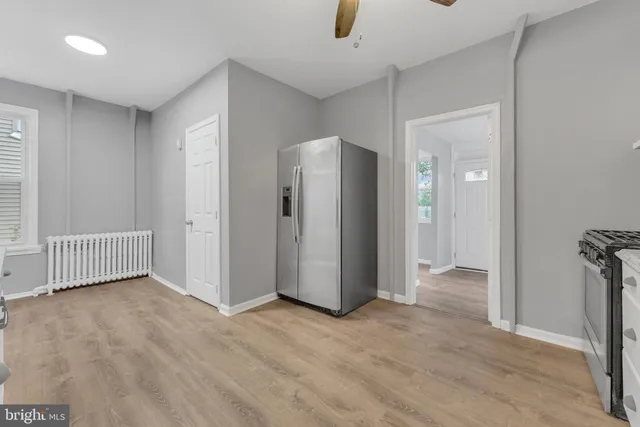a kitchen with granite countertop a sink and a stove