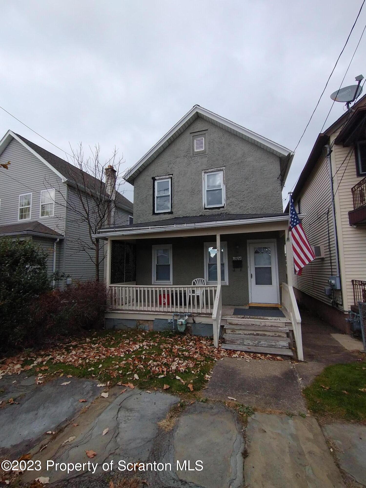 1604 Hawthorne Street Scranton, PA 18504 - Photo 1 of 11 a front view of a house with a yard
