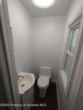 a bathroom with a toilet and a sink