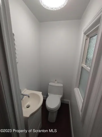 a bathroom with a toilet and a sink