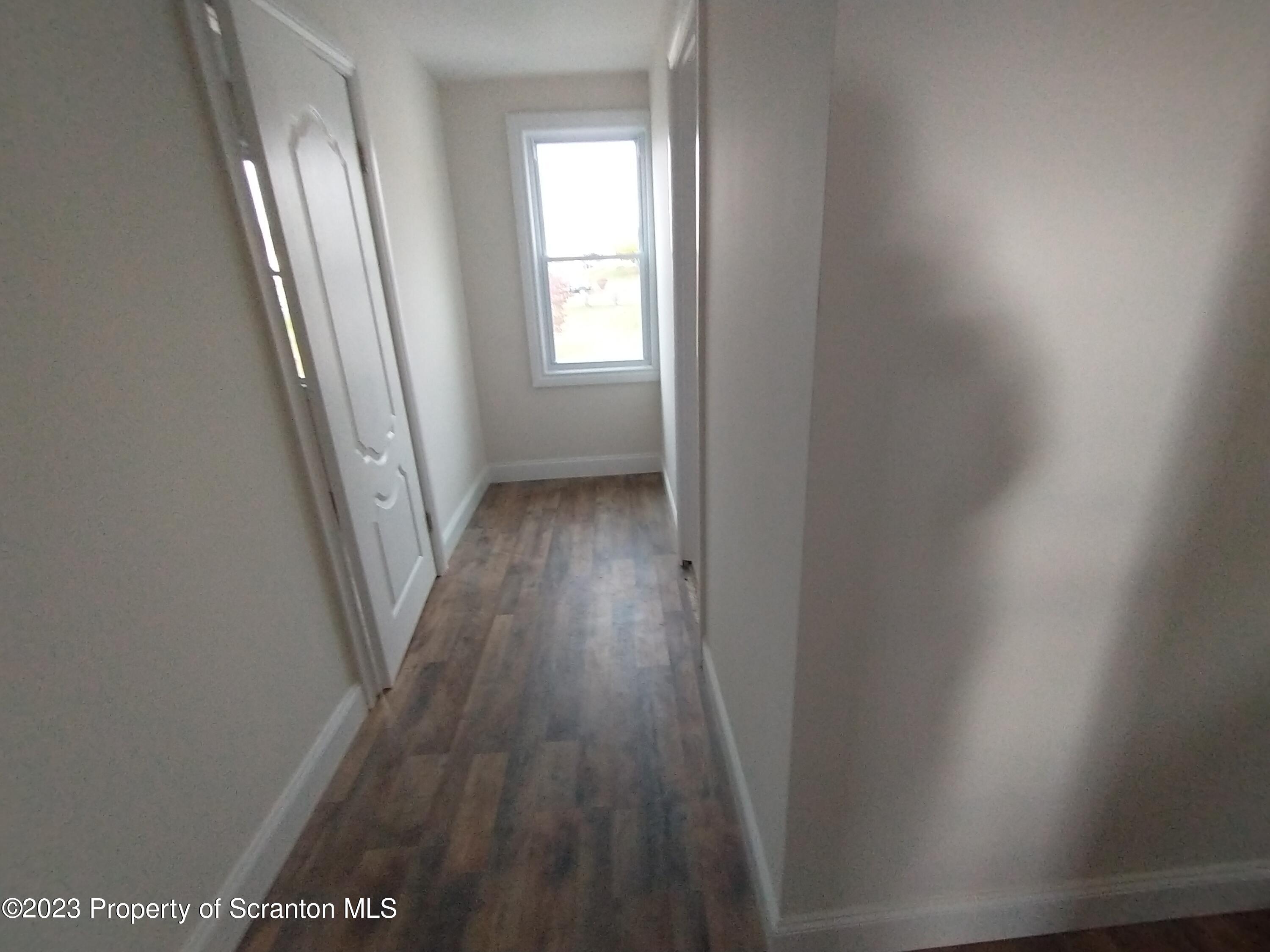 1604 Hawthorne Street Scranton, PA 18504 - Photo 8 of 11 a view of a hallway and wooden floor