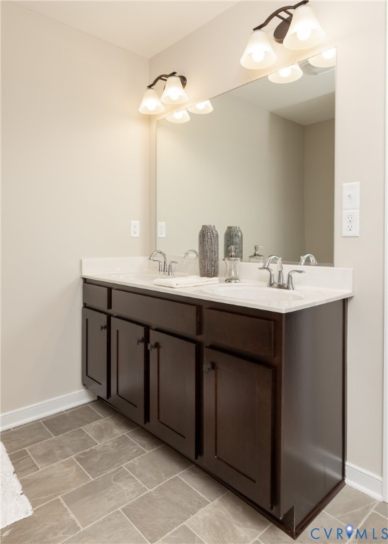 146 Wendenburg Court, Unit F3 Aylett, VA 23009 - Photo 11 of 15 Bathroom featuring double vanity and baseboards