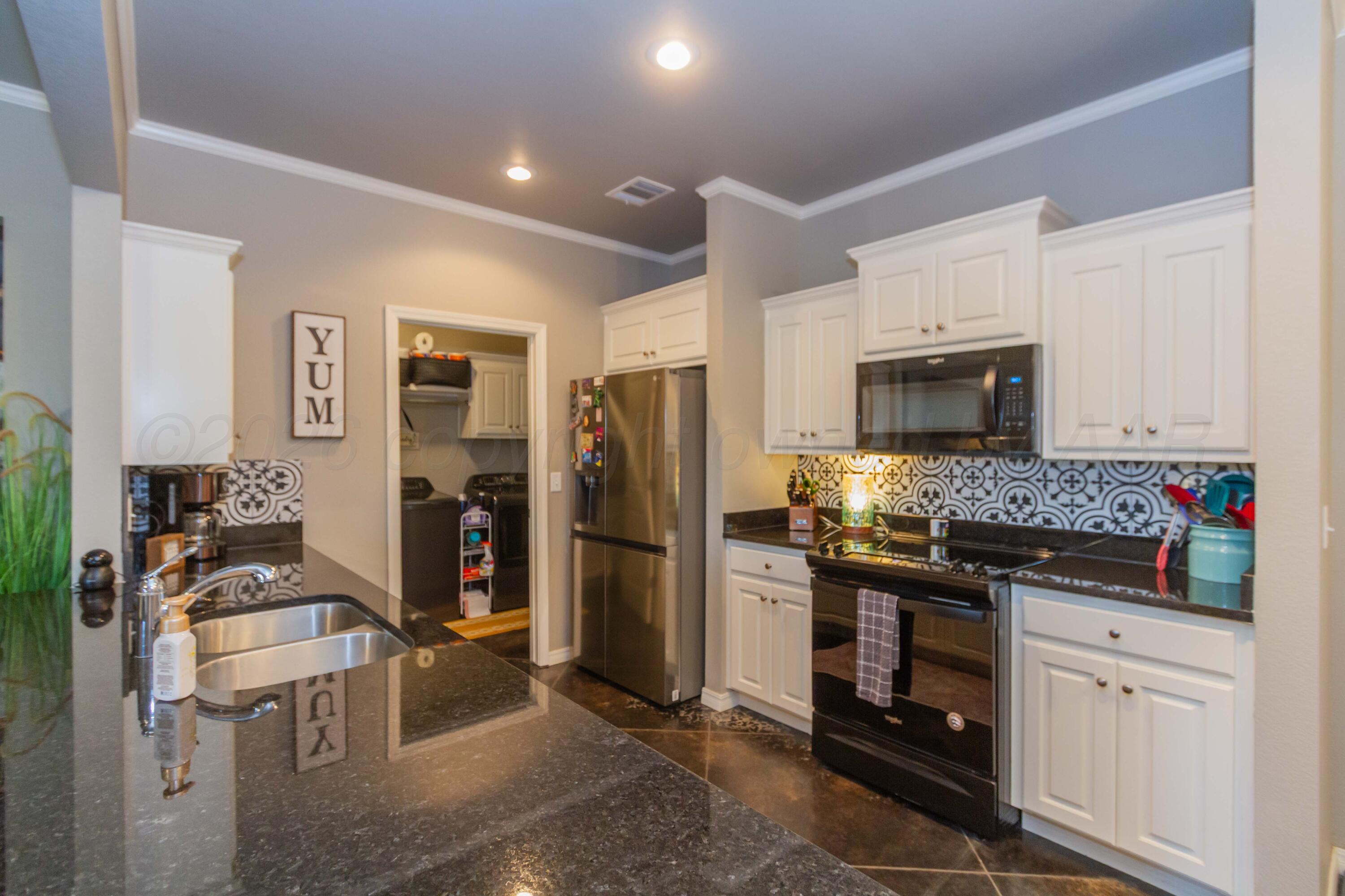 9921 Will Avenue Amarillo, TX 79119 - Photo 8 of 38 KITCHEN VIEW 1