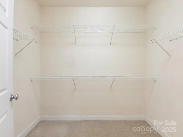 a view of a room with racks on the wall