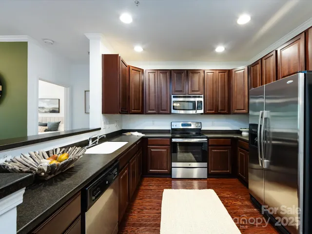 a kitchen with a sink stove and refrigerator