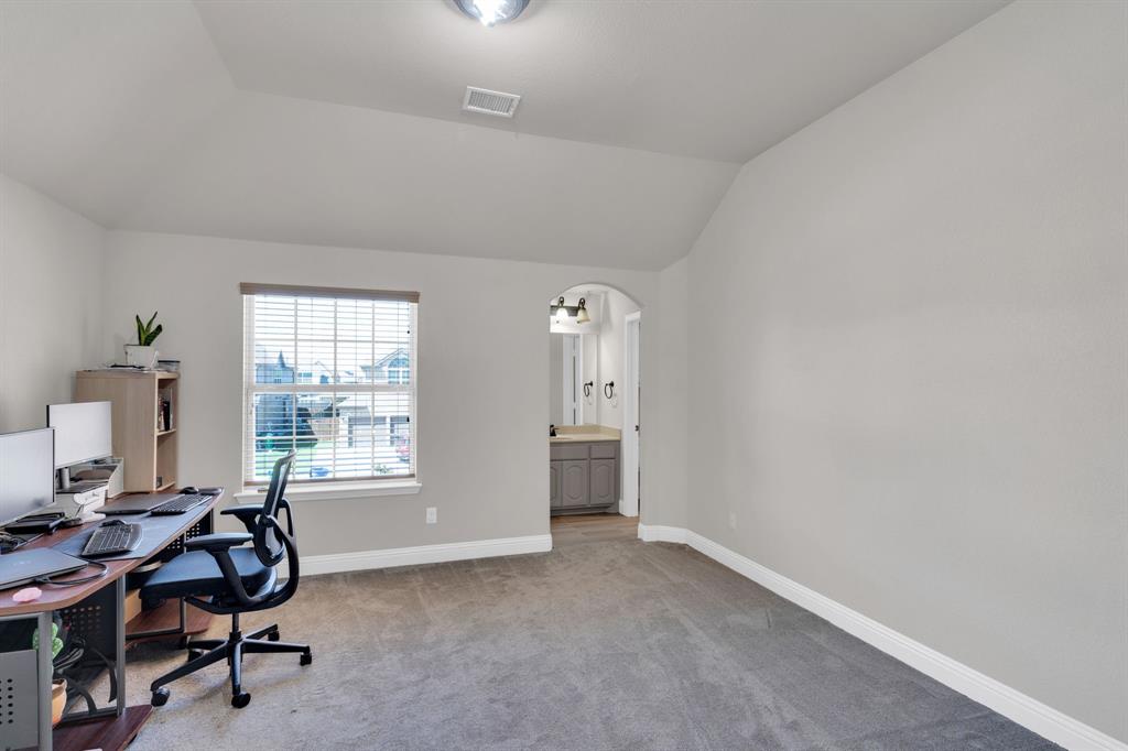 129 Micco Lane Fate, TX 75087 - Photo 16 of 31 a view of a workspace with furniture and a window
