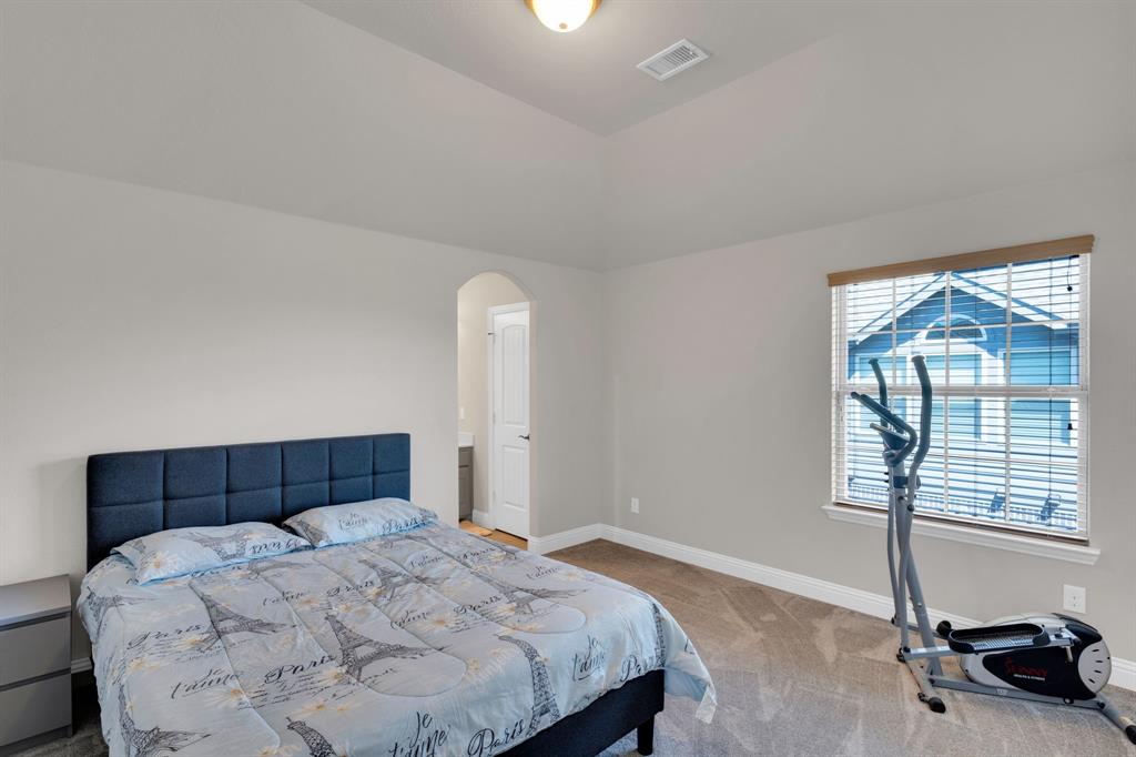 129 Micco Lane Fate, TX 75087 - Photo 20 of 31 a bedroom with a bed and a window