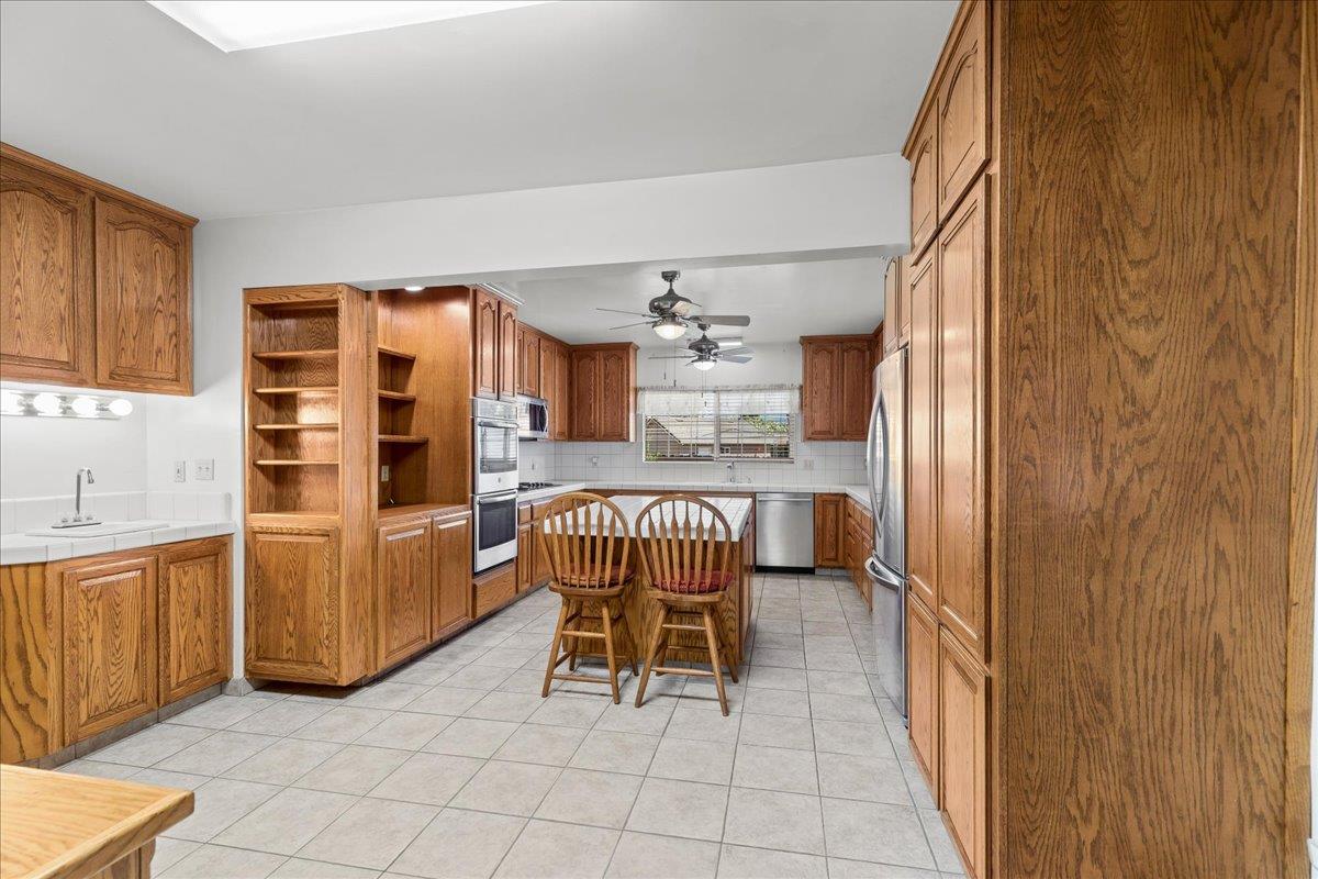 4701 Lone Tree Road Valley Home, CA 95361 - Photo 18 of 59 a dining room with furniture and window