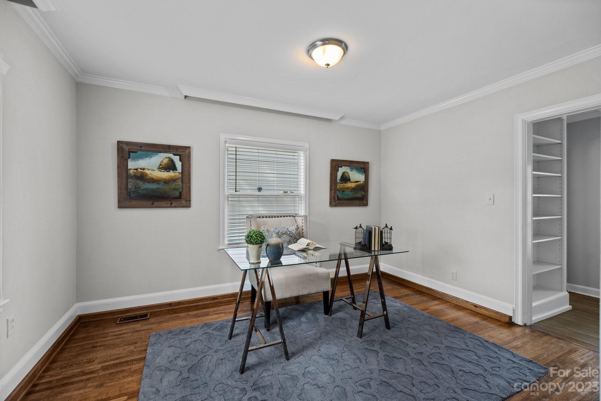 312 Brandywine Road Charlotte, NC 28209 - Photo 14 of 31 a work room with furniture and wooden floor