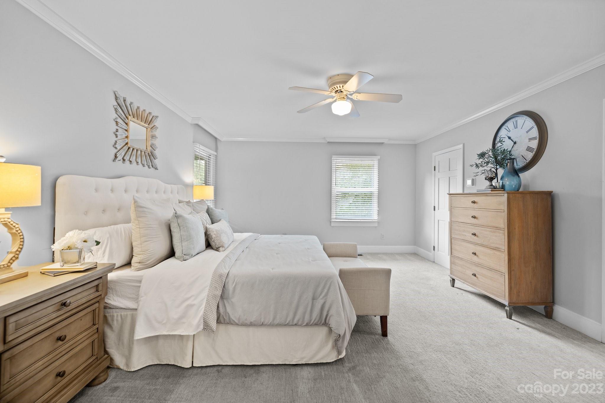 312 Brandywine Road Charlotte, NC 28209 - Photo 17 of 31 a bedroom with a bed and a chandelier