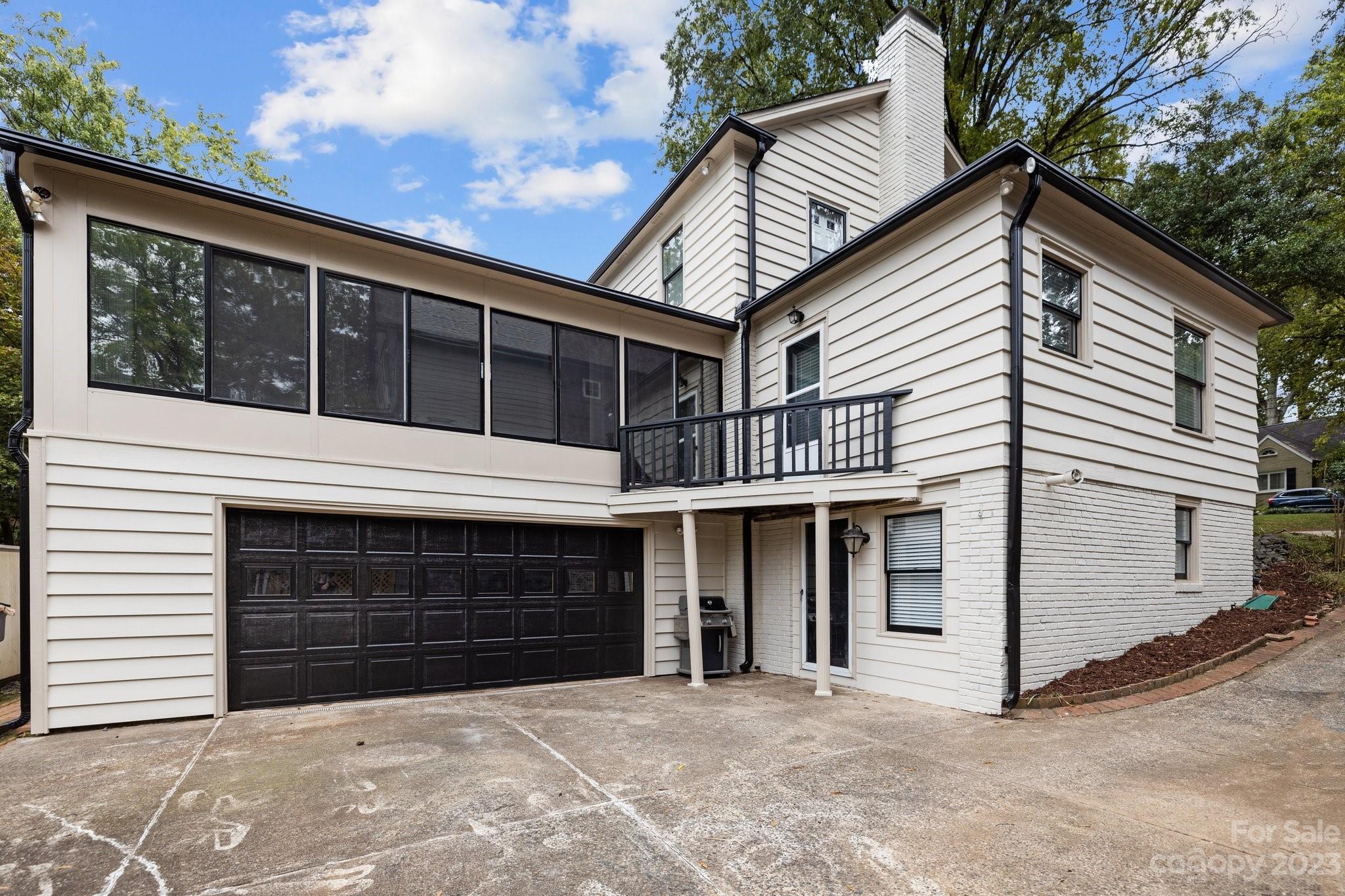 312 Brandywine Road Charlotte, NC 28209 - Photo 2 of 31 a front view of a house with a garage