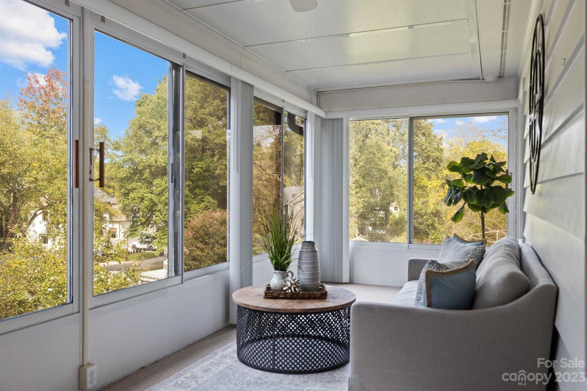 312 Brandywine Road Charlotte, NC 28209 - Photo 21 of 31 a living room with furniture and a large window