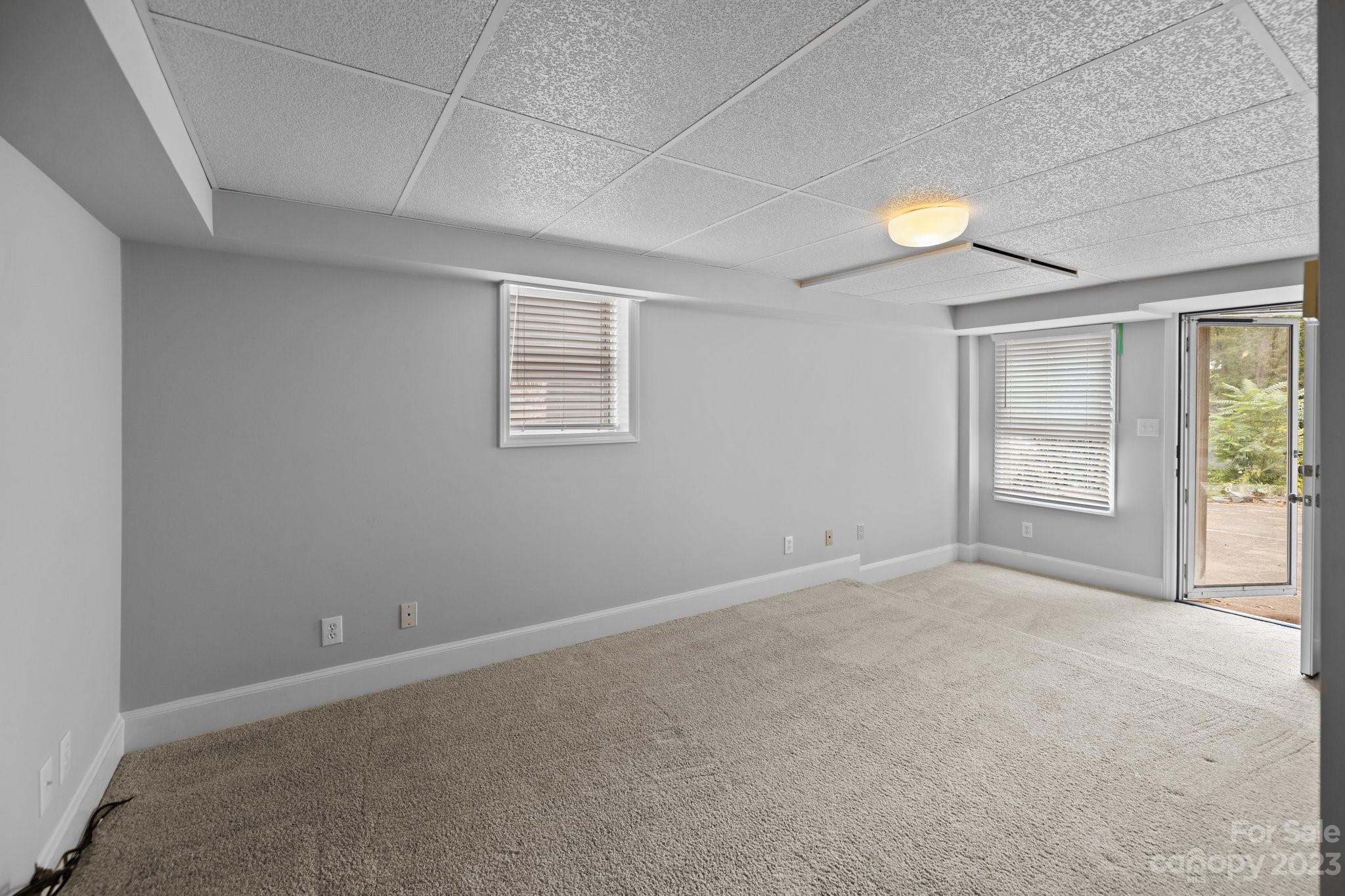 312 Brandywine Road Charlotte, NC 28209 - Photo 28 of 31 an empty room with windows
