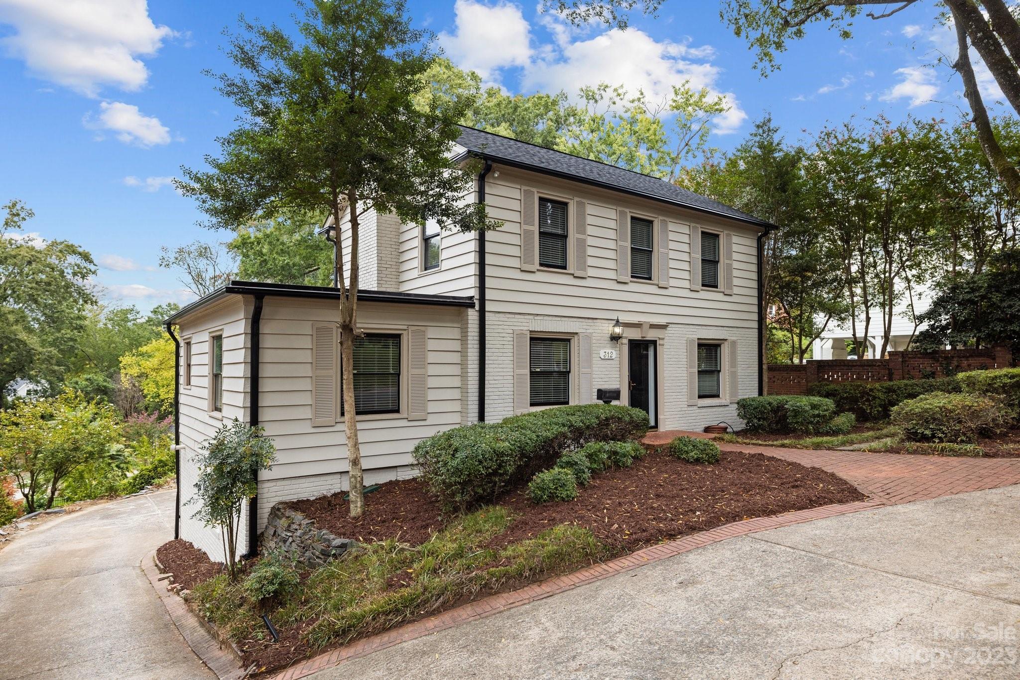 312 Brandywine Road Charlotte, NC 28209 - Photo 4 of 31 a front view of a house with garden