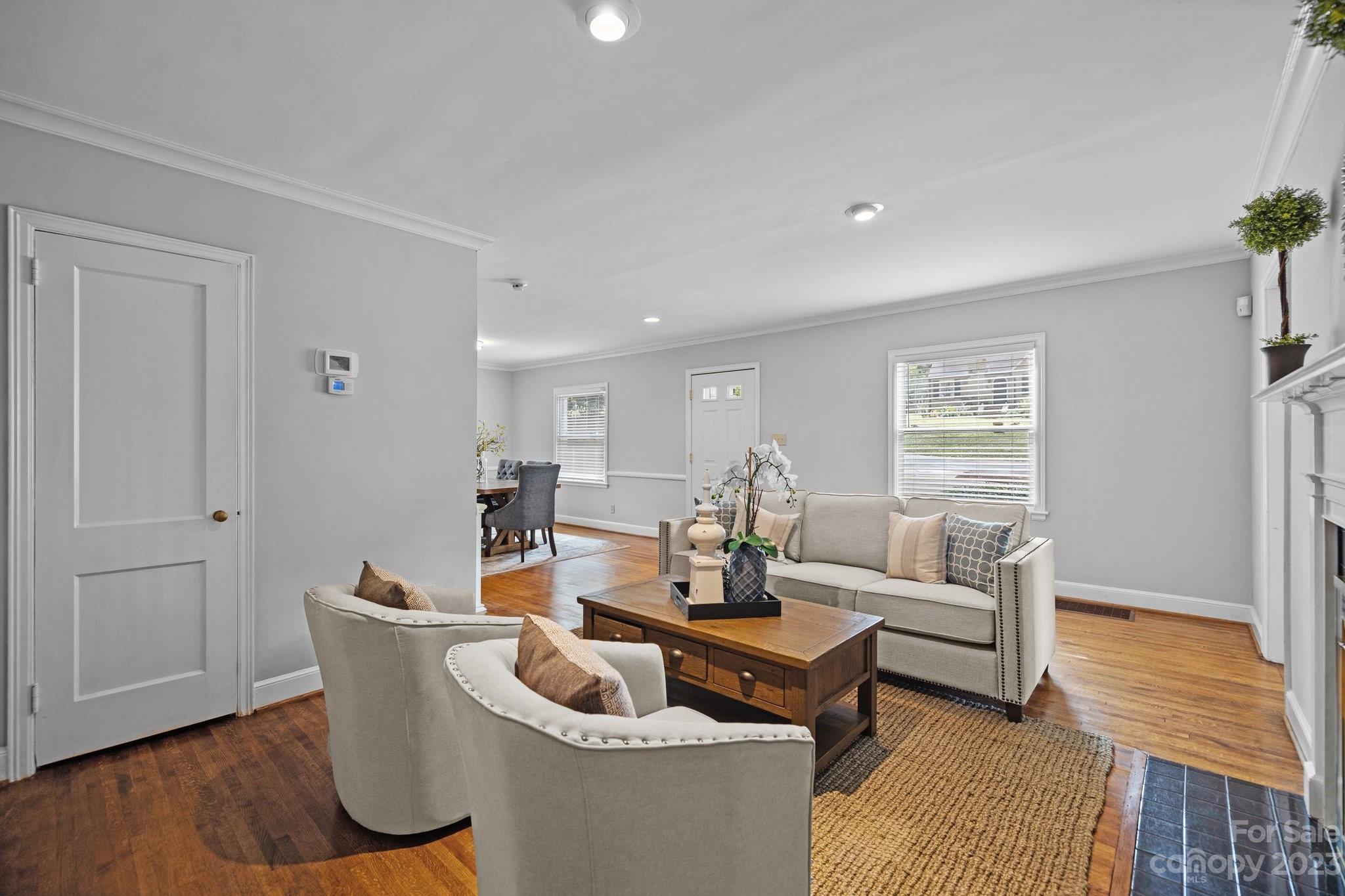 312 Brandywine Road Charlotte, NC 28209 - Photo 7 of 31 a living room with furniture and a wooden floor
