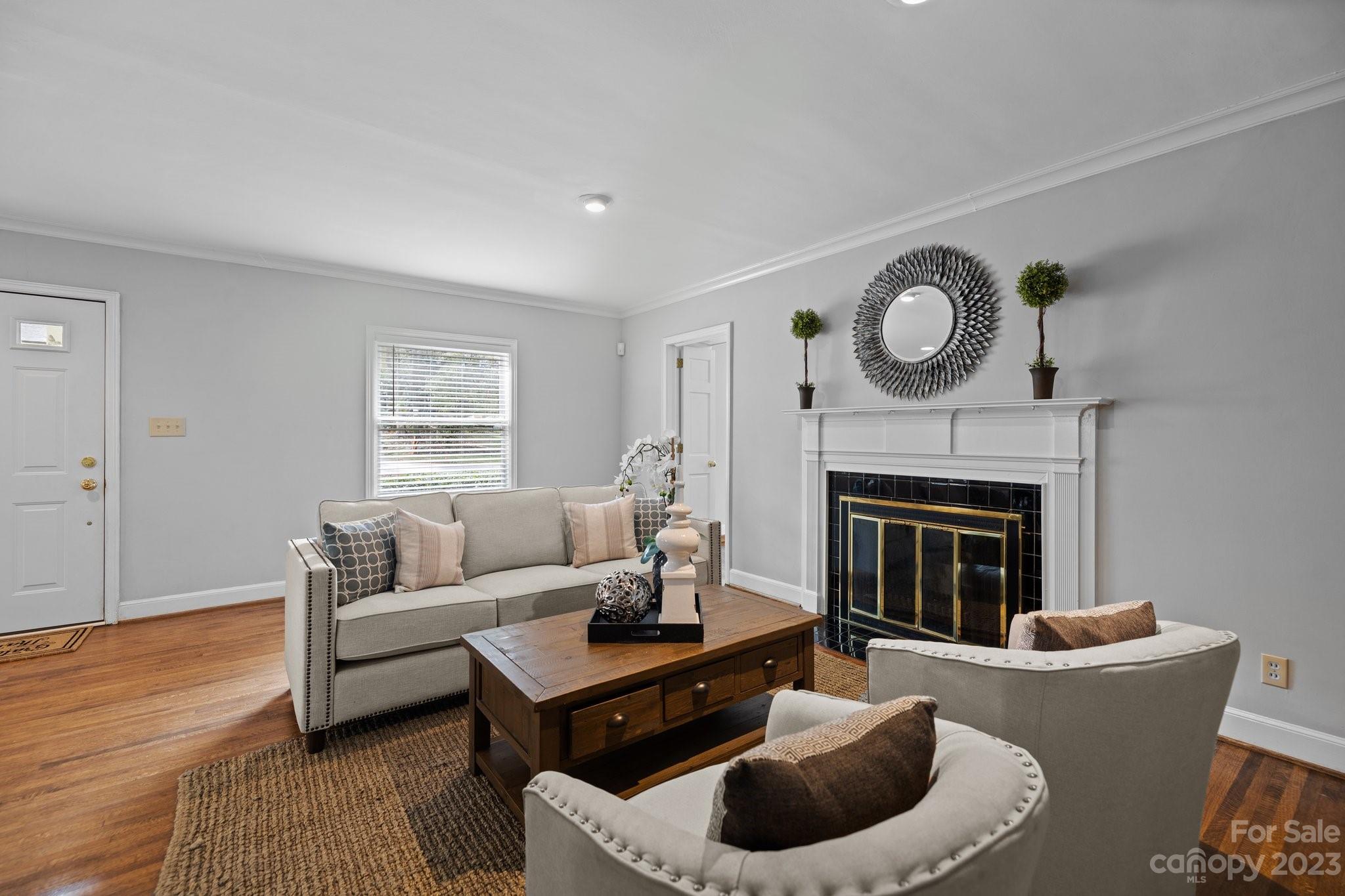 312 Brandywine Road Charlotte, NC 28209 - Photo 8 of 31 a living room with furniture and a fireplace