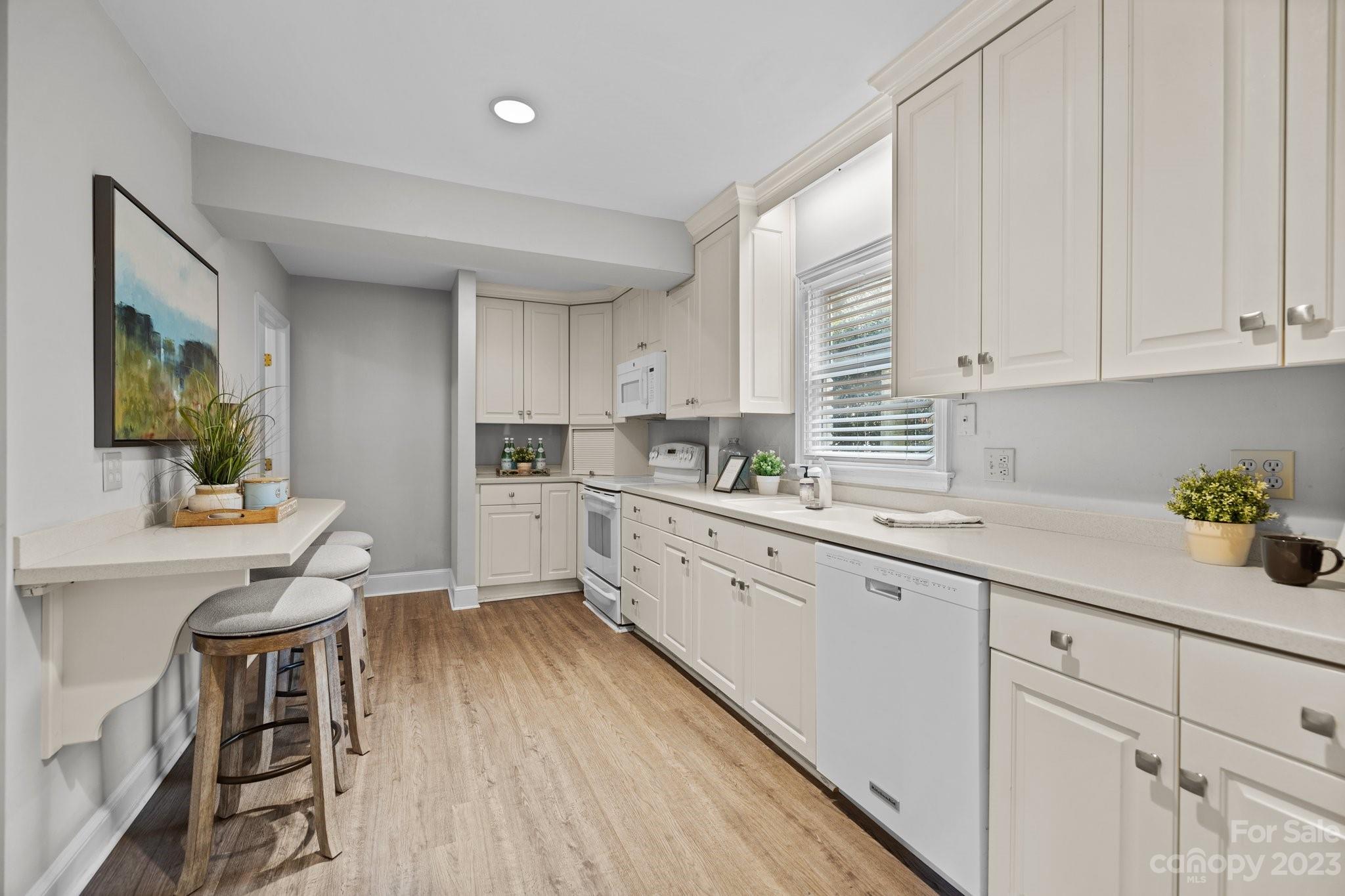 312 Brandywine Road Charlotte, NC 28209 - Photo 10 of 31 a kitchen with cabinets a sink and appliances