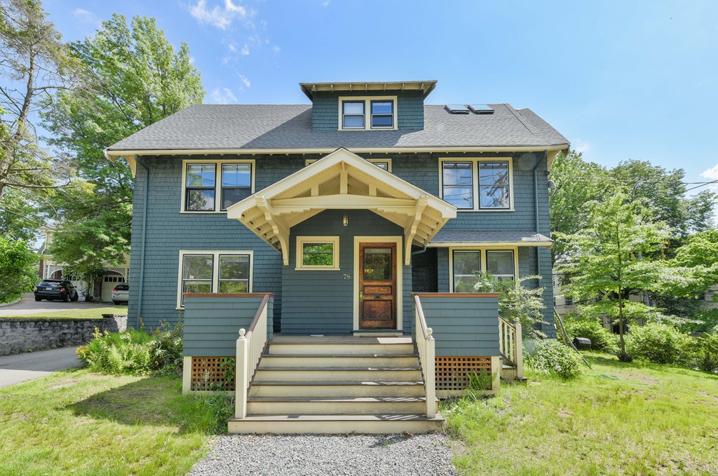 78 Windsor Road, Unit 1 Brookline, MA 02445 - Photo 1 of 11 a front view of a house with a yard