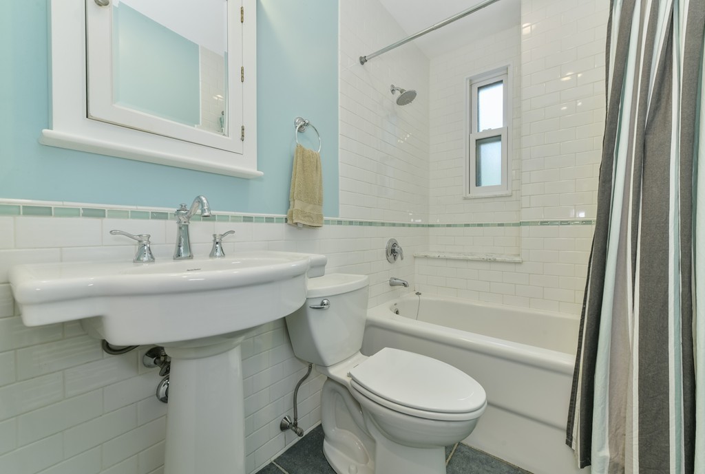 78 Windsor Road, Unit 1 Brookline, MA 02445 - Photo 9 of 11 a bathroom with a sink a toilet and shower