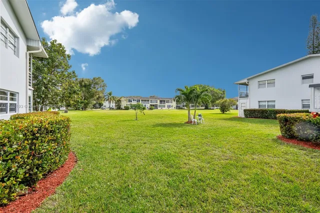 a view of a house with a big yard