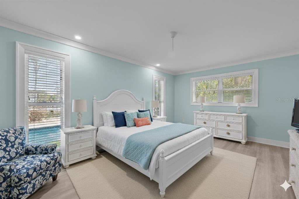8552 Lagoon Road Fort Myers Beach, FL 33931 - Photo 12 of 33 a bedroom with a large bed and a window